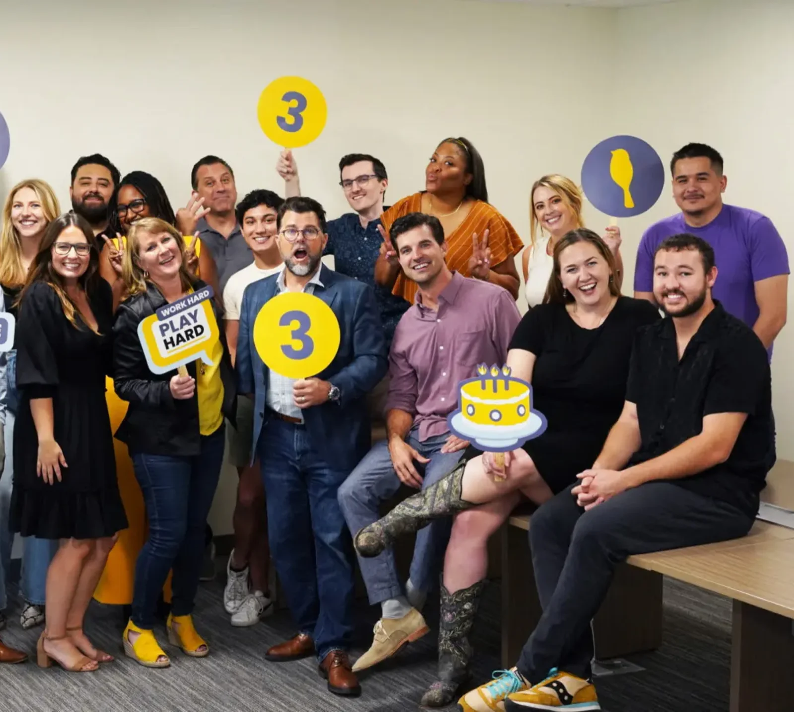 Diverse small business team celebrating a successful hire after using Crew for applicant tracking and onboarding